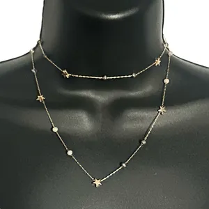 Frenzy long gold tone station stars and crystals necklace thumbnail 1