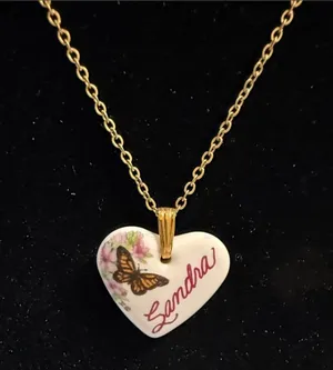 Source Unknown Gold-Tone Chain with White Heart Pendant and Butterfly Detail thumbnail 1
