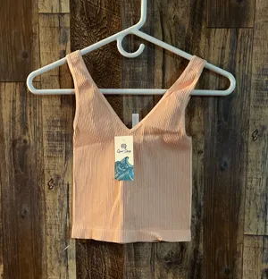 NIKIBIKI Women Seamless Plunge V-Neck Ribbed Crop Top, Made in U.S.A, One Size Elevate your style with this chic peach ribbed V-neck top. Perfect for any occasion. thumbnail 2