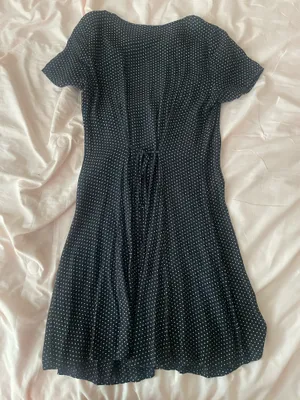 Black polka dot dress with ruffle neckline and short sleeves thumbnail 2