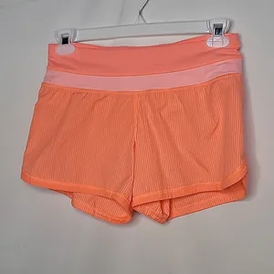 Lululemon running workout neon orange slip on shorts sz 6 thumbnail 1