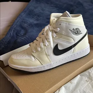 Nike Air Jordan 1 Mid Ivory and Black Shoes thumbnail 1