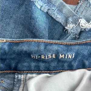 American Eagle Hi-Rise Mini Denim Jean Skirt Distressed Size 0 Blue thumbnail 2