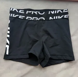 Nike Pro Black Compression Shorts with White Logo Waistband thumbnail 1