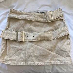 PrettyLittleThing Beige Mini Skirt with Double Buckle Straps thumbnail 1