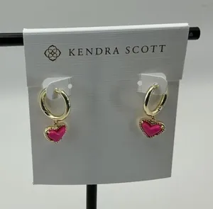Brand new Kendra Scott Ari huggie earrings with pink heart charms thumbnail 1