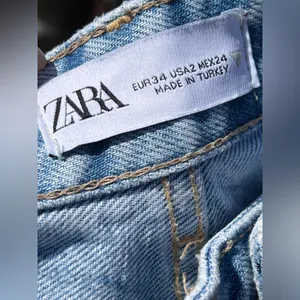 Zara women’s high - waisted Ripped wide leg jeans thumbnail 11