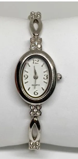 Silver tone women’s quartz analog watch 19mm oval white dial rhinestones running thumbnail 1