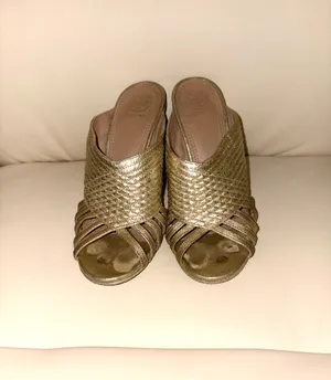 Tory Burch Brida high-heeled mules in metallic gold leather (color "Gold"). They have minor damage to the insole. Size 7 thumbnail 2