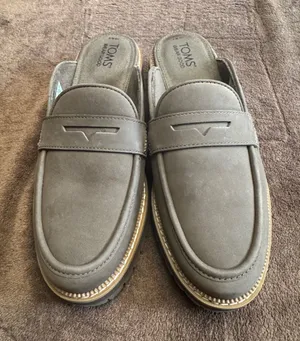 TOMS Cara mule loafers, featuring a slip-on design with a classic penny strap thumbnail 1