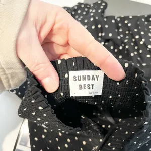 Aritzia Sunday Best Smocked Tiered Ruffle Polka Dot Mini Skirt Black Medium thumbnail 2