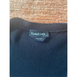 Black BEBE Long Sleeve Knitted Bodycon Dress with V-Neck and Off Shoulder Size L thumbnail 2