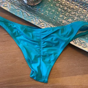 Victoria’s Secret turquoise bathing suit bottoms thumbnail 2