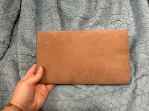 Soft suede envelope clutch with gold-tone accent along the flap. Elegant, minimalist design. Versatile for day or evening wear. thumbnail 2