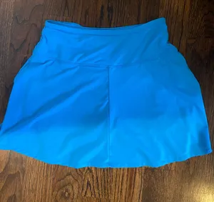Bright blue tennis skirt with built in shorts thumbnail 1