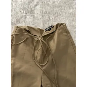 I.AM.GIA Faux Leather Tie-Up Flare Pants in the tan Size Large thumbnail 6