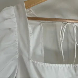 H&M Tie Detail Puff-Sleeved Peplum Blouse. White. Size: Large. thumbnail 4
