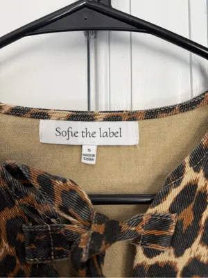 Leopard-Print Tie-Front Peplum Blouse in Tan & Black thumbnail 4