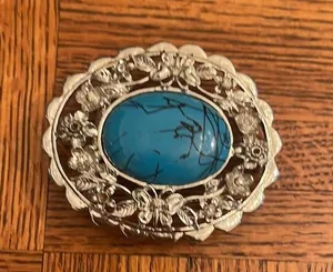 Metal belt buckle with a man-made stone thumbnail 1