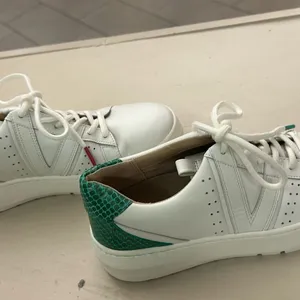 Sneakers White Leather Women's Sneakers with Green Heel Accent 6 by Vionic thumbnail 9