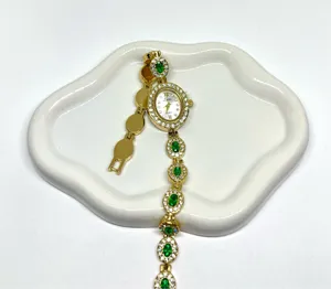 Luxury women’s watch sparkly emerald green stone thumbnail 5