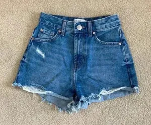 Primark high rise blue distressed jean shorts in size 0 thumbnail 1