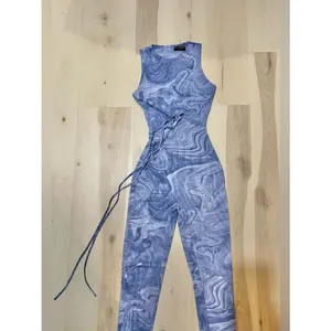 Naked Wardrobe NWT Women Small Blue Marble Mesh No Strings Attached Jumpsuit thumbnail 4