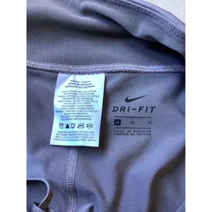 Nike Dri-FIT Womens Purple Crop Running Leggings Mesh Zipper Pocket Size M thumbnail 7