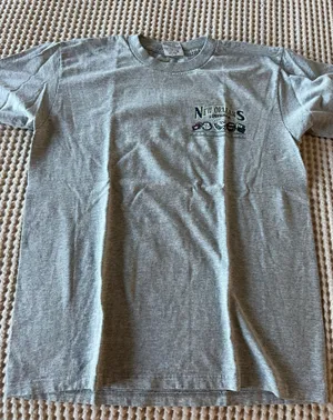 Gildan Classic gray short-sleeve tee featuring a small New Orleans Louisiana graphic on the chest. Comfortable cotton blend with a relaxed fit. Versatile gray color pairs well with casual outfits. Ideal for everyday wear and travel. thumbnail 1
