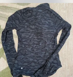 Lululemon black camo jacket Size 4 it also has an opening for a ponytail in the hood. Fantastic condition #athleisure #camouflage #lululemon thumbnail 2