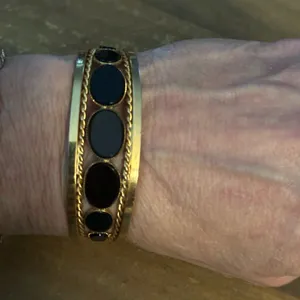 Gold tone open hinged bangle with oval black stones thumbnail 2