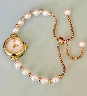 Brand New Gold pearl watch with white face and Roman numerals thumbnail 1