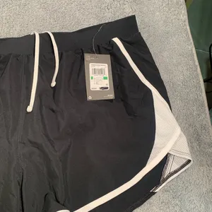 Under Armour Women's Black and White Athletic Shorts thumbnail 3