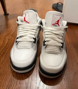 Air Jordan 4 Retro “White Cement” sneakers in Grade School (GS) size 6.5Y thumbnail 1