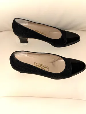 Salvatore Ferragamo black textured patent leather heels with a vintage-style toe cap. The rest of the shoe has a subtle texture. Made in Italy. thumbnail 2