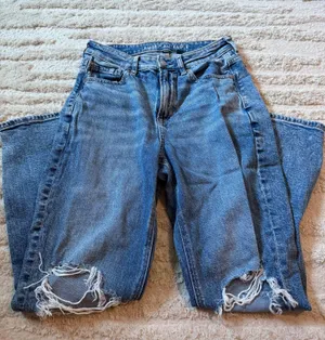 RIPPED AMERICAN EAGLE STRIGID BLUE JEANS thumbnail 1