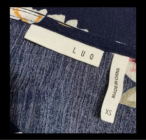 LUQ Navy Floral Tie-Up Blouse - size XSmall ***Refer to measurements. Gently warn & loved. Measurements approximately 20” from armpit to armpit x 20” long. Non-smoking home. priced to sell at as is condition. Don’t like my price, make reasonable offer! And thank you for checking my closet. thumbnail 5