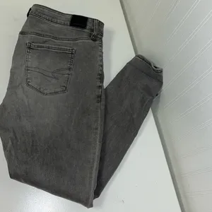 American Eagle hi-rise Jegging Grey distressed jeans. thumbnail 2