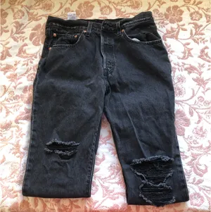 Levi's 501 black jeans with ripped knees #denim thumbnail 1