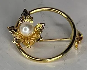 Vintage pearl adorned maple leaf open circle brooch. Gold thumbnail 1