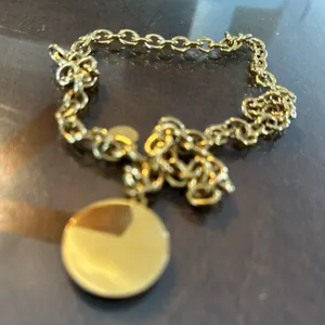 Gold tone coin pendant necklace with a round charm and chain thumbnail 4