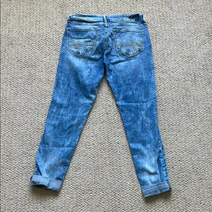 Denizen from Levi's Distressed Blue Low Rise Jeans thumbnail 8