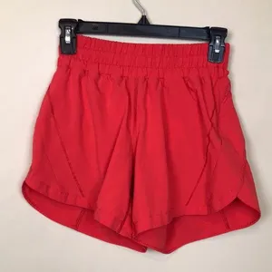 Lululemon Women’s Track That Mid Rise Coral Red Lined Athletic Workout Shorts thumbnail 1