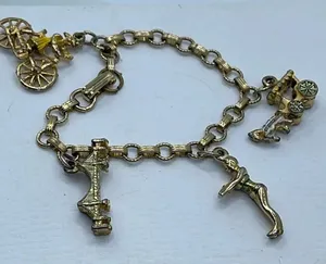 Vintage 6” charm bracelet. Gold tone with crossover clasp. thumbnail 1