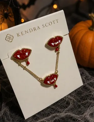 Kendra Scott red lip earrings featuring a playful vampire fang and blood drop de thumbnail 1