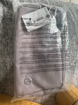lululemon light grey travel pouch with red packing sleeve thumbnail 8