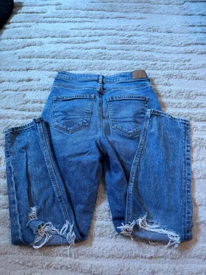 RIPPED AMERICAN EAGLE STRIGID BLUE JEANS thumbnail 2