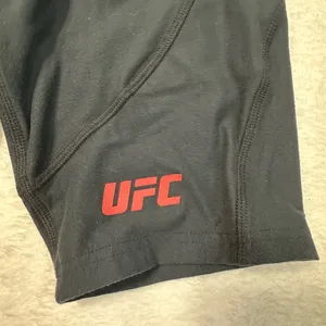 UFC Women's Black Bike Shorts with Red Logo and Side Pockets thumbnail 2