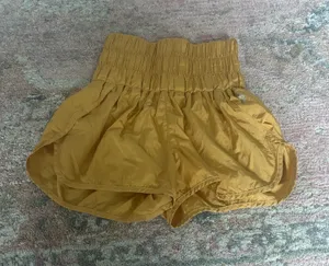 Yellow gold free people movement shorts thumbnail 1