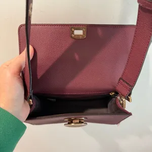 NWT Charles &‎ Keith Burgundy Circular Push Lock Crossbody Bag thumbnail 9